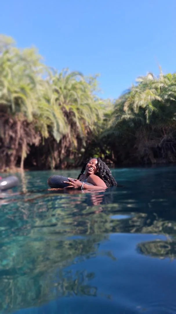 Guest smiling in the water at Chemka