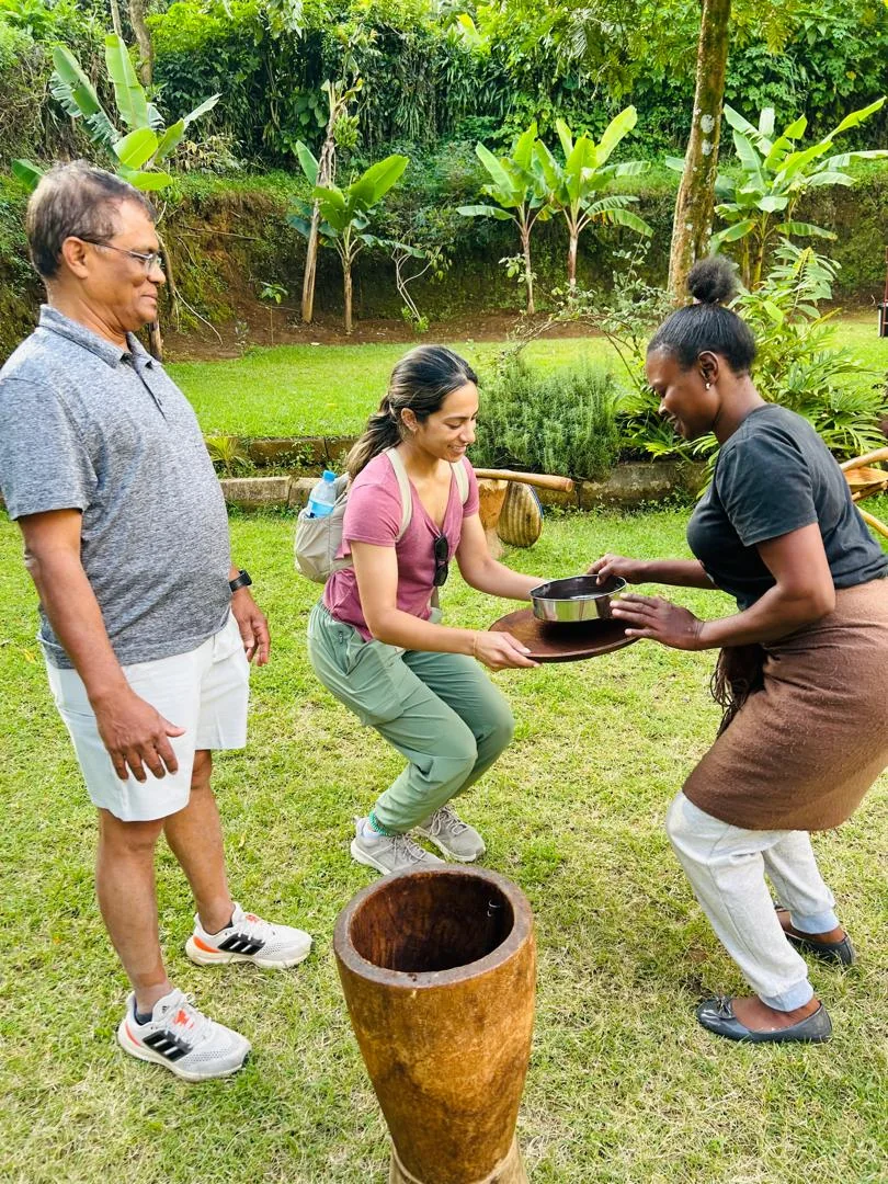 Local host handing coffee to a guest