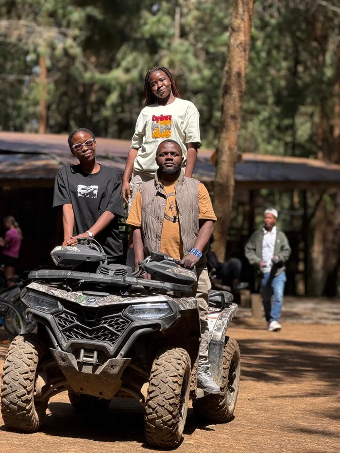 Guests riding quad bikes on the trail