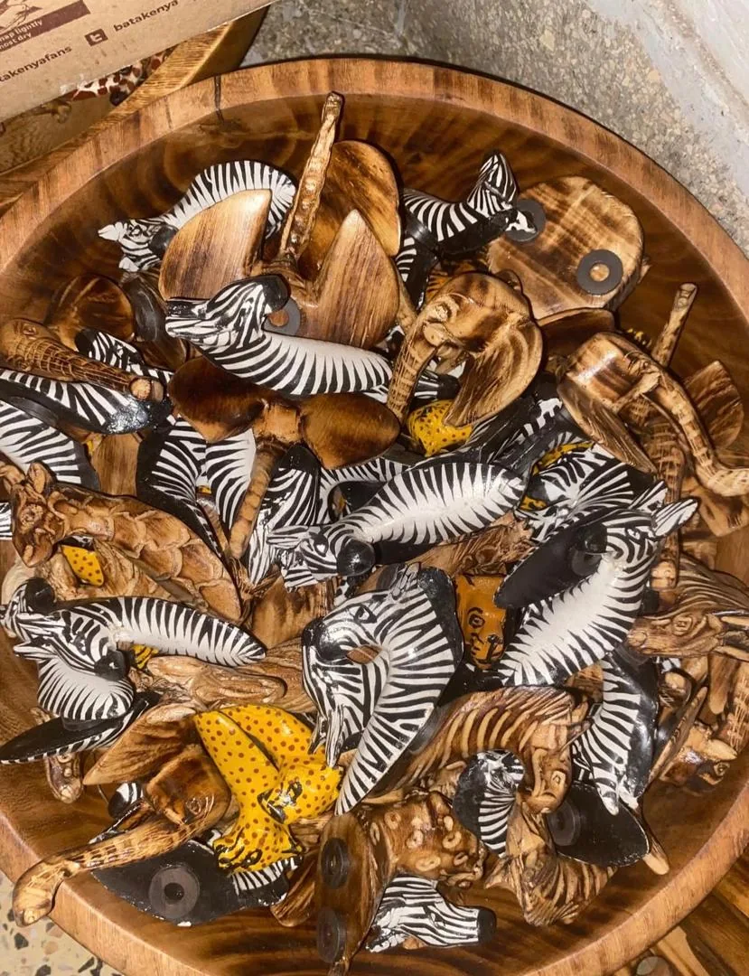 Bowl of hand-carved wooden animal souvenirs