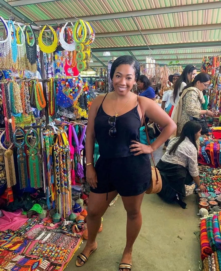 Guest browsing a beadwork stall at the Maasai Market